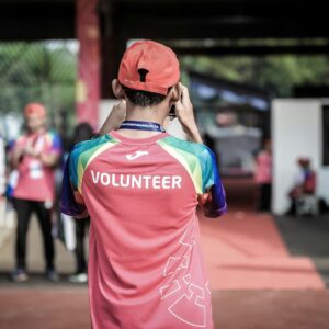 person standing wearing red shirt